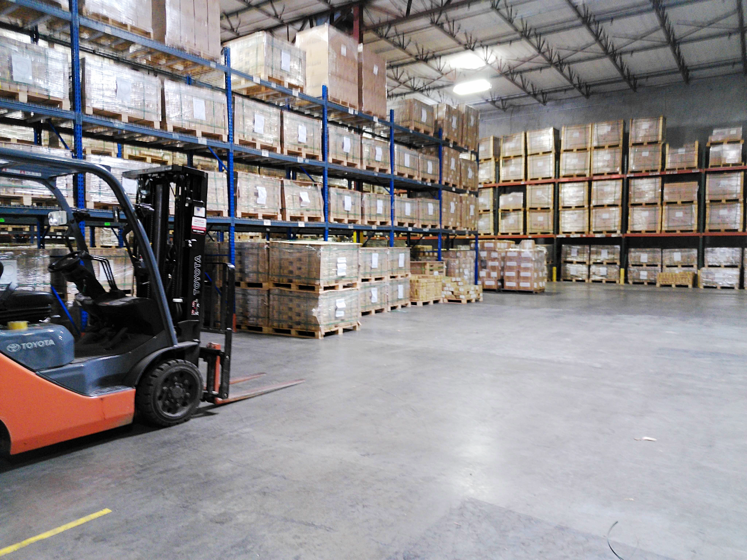 warehouse with forklift and parts